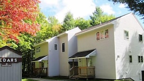 A two-story building with a covered porch and a small shed labeled 'EDARS'. - Mount Snow Condominiums (West Dover)