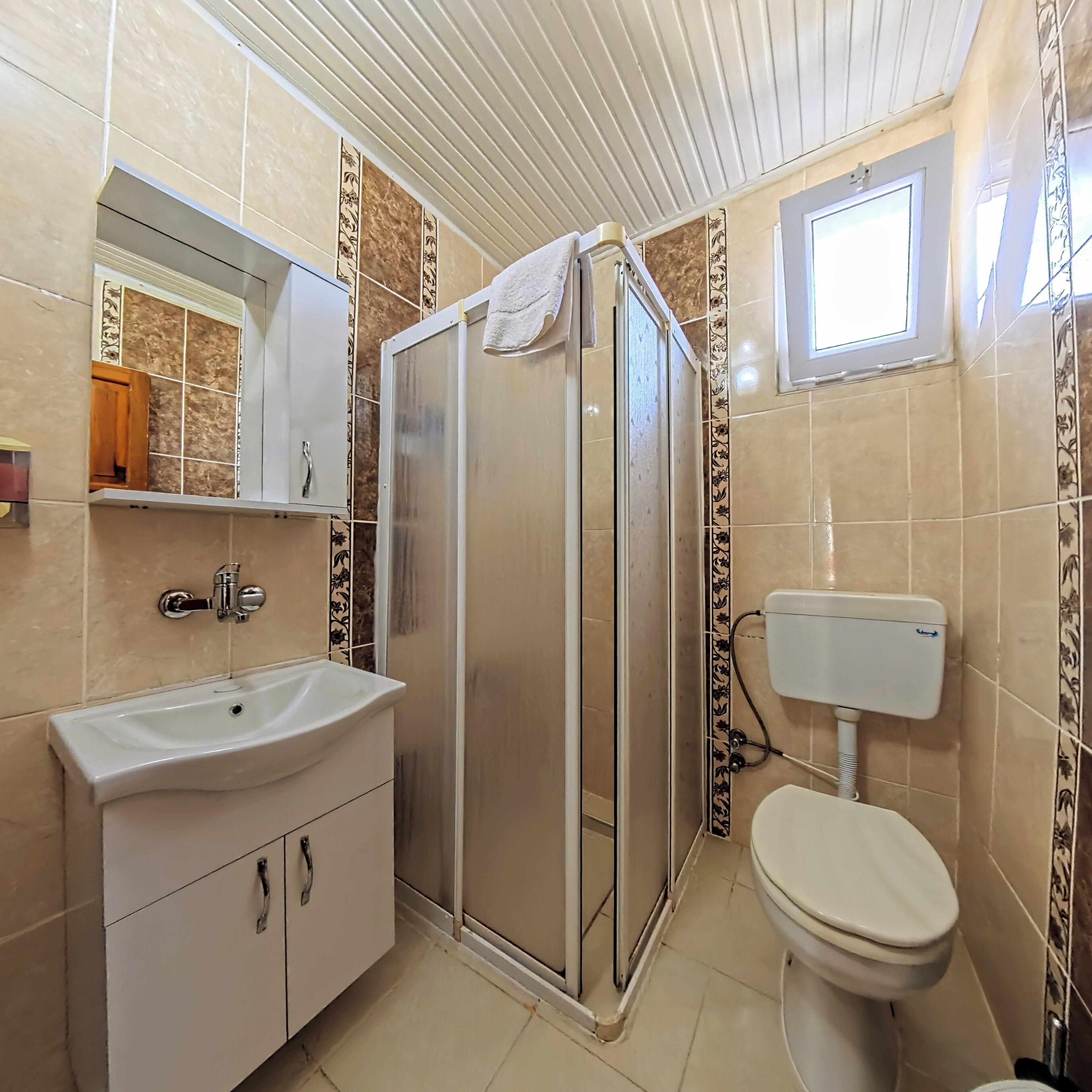 shower, hair dryer, bathrobes, slippers