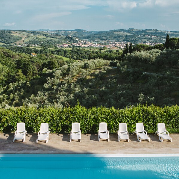 Outdoor pool, open 8:30 AM to 8:00 PM, pool loungers