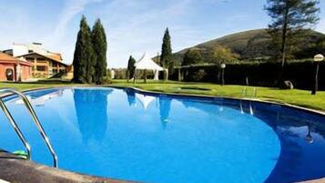 Indoor pool, seasonal outdoor pool, pool umbrellas, sun loungers