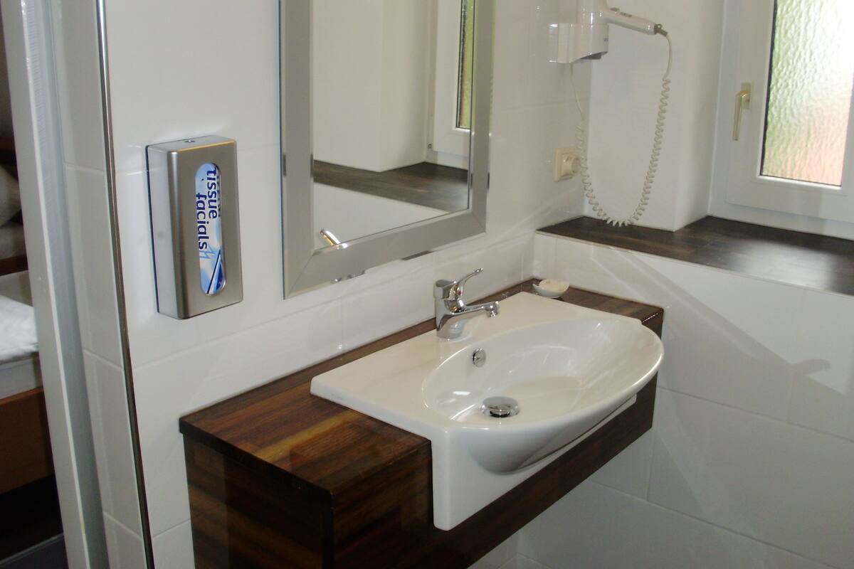 economy twin room, 2 single beds | bathroom | shower, free toiletries, hair dryer, towels