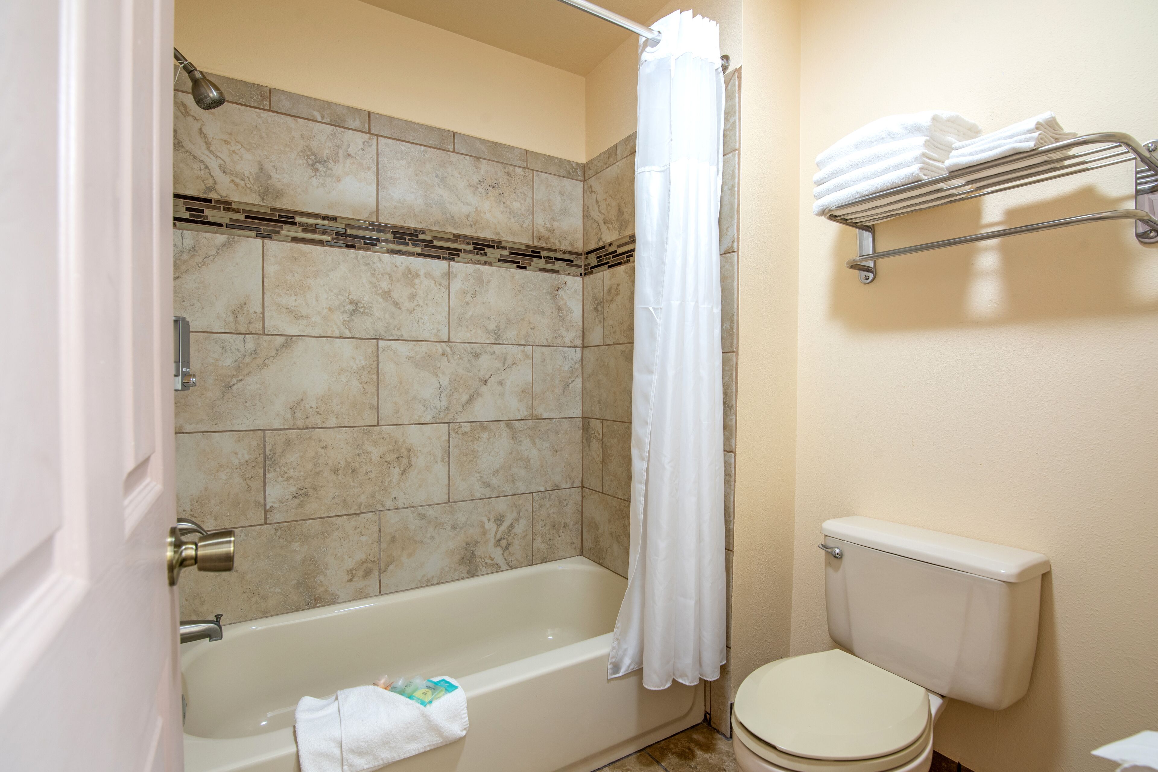 Deluxe Room, 2 Queen Beds | Bathroom | Combined shower/bathtub, free toiletries, hair dryer, towels