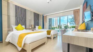 Deluxe Pool Access Room | In-room safe, desk, laptop workspace, blackout drapes
