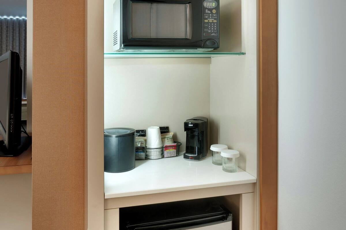 desk, laptop workspace, blackout curtains, iron/ironing board