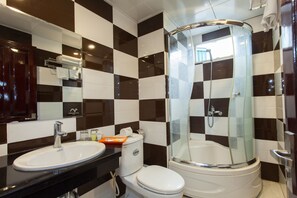 Deluxe Room, 1 Double or 2 Twin Beds | Bathroom | Shower, free toiletries, hair dryer, slippers