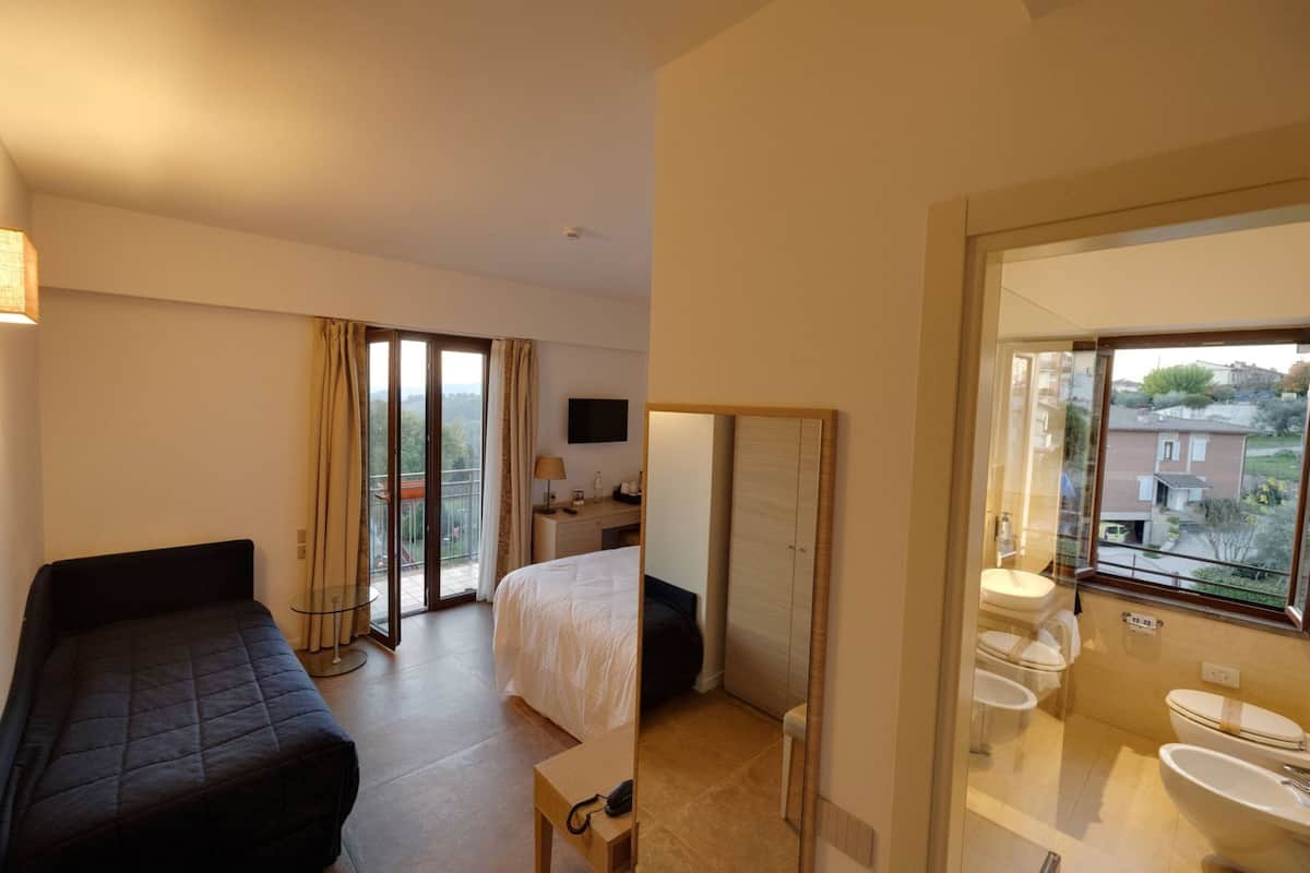 Triple Room | Minibar, in-room safe, desk, laptop workspace