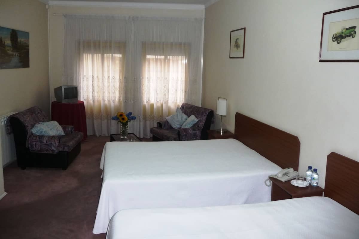Quadruple Room | In-room safe, individually furnished, desk, iron/ironing board