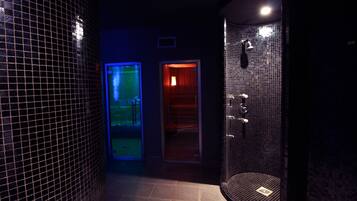 Experience a serene bathroom retreat with a curved shower area and glass door offering a view of the adjacent space.