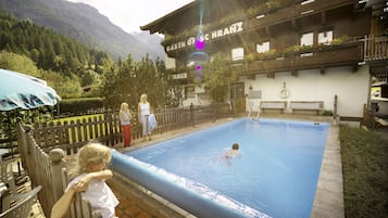 Seasonal outdoor pool, pool loungers