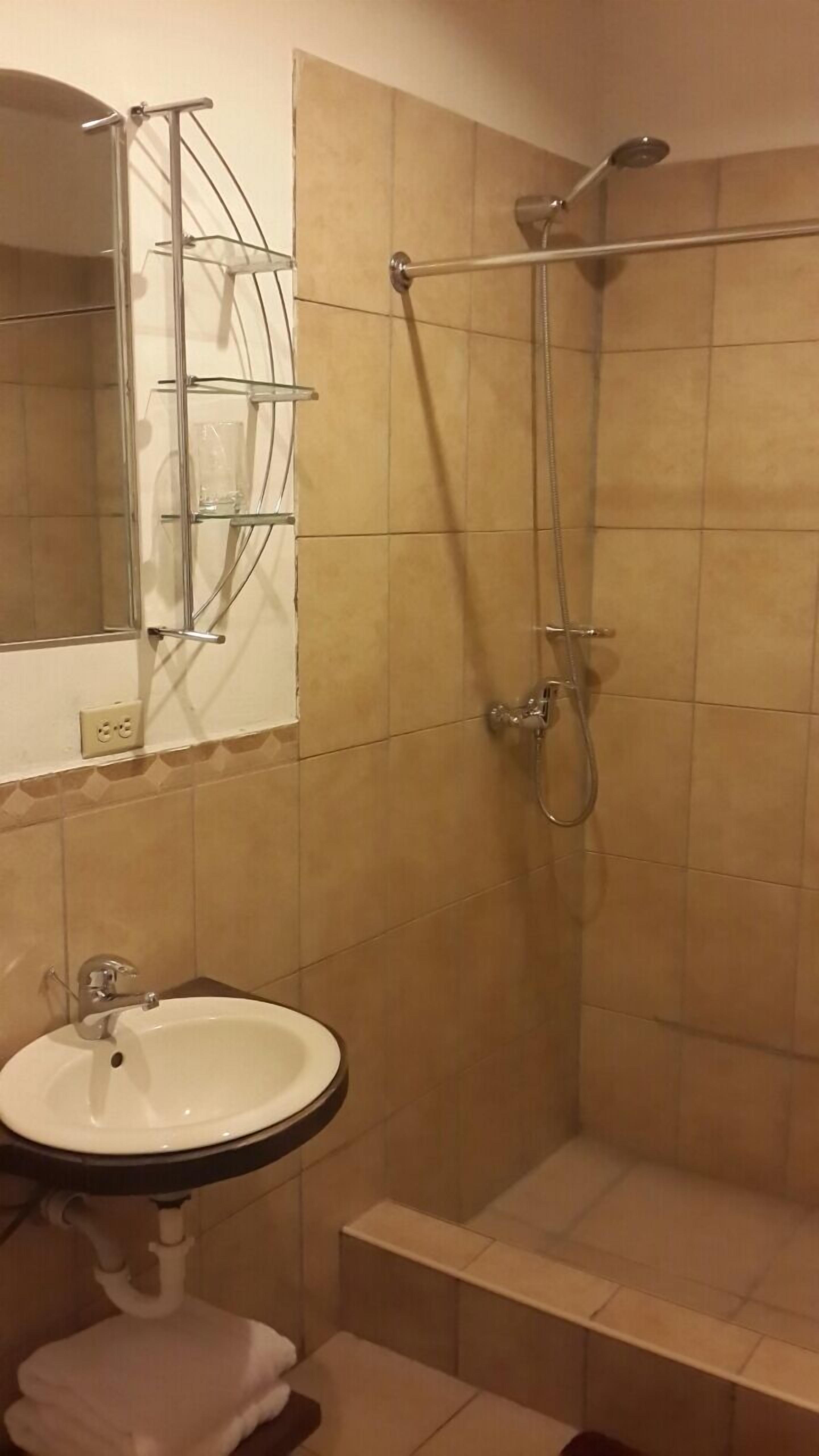senior suite | bathroom | shower, rainfall showerhead, free toiletries, hair dryer