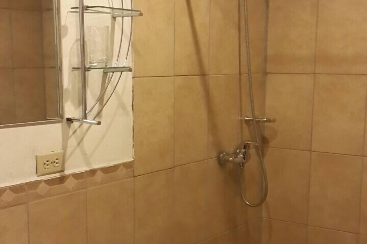 senior suite | bathroom | shower, rainfall showerhead, free toiletries, hair dryer