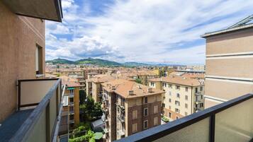 Enjoy breathtaking views of the city from this high-rise residence's spacious balcony.