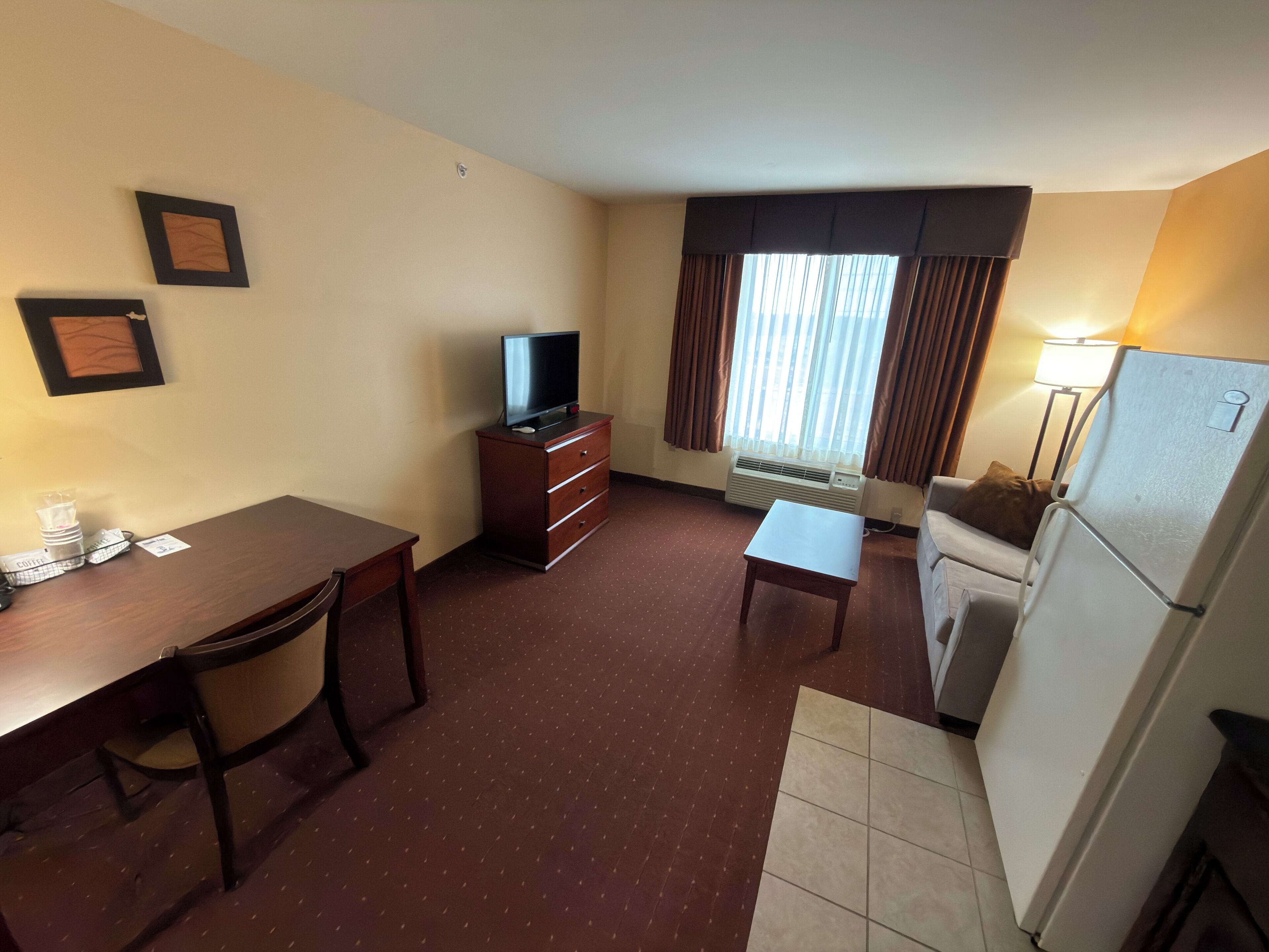 Suite, 2 Queen Beds, Kitchenette | Living area | 32-inch flat-screen TV with cable channels, TV, DVD player