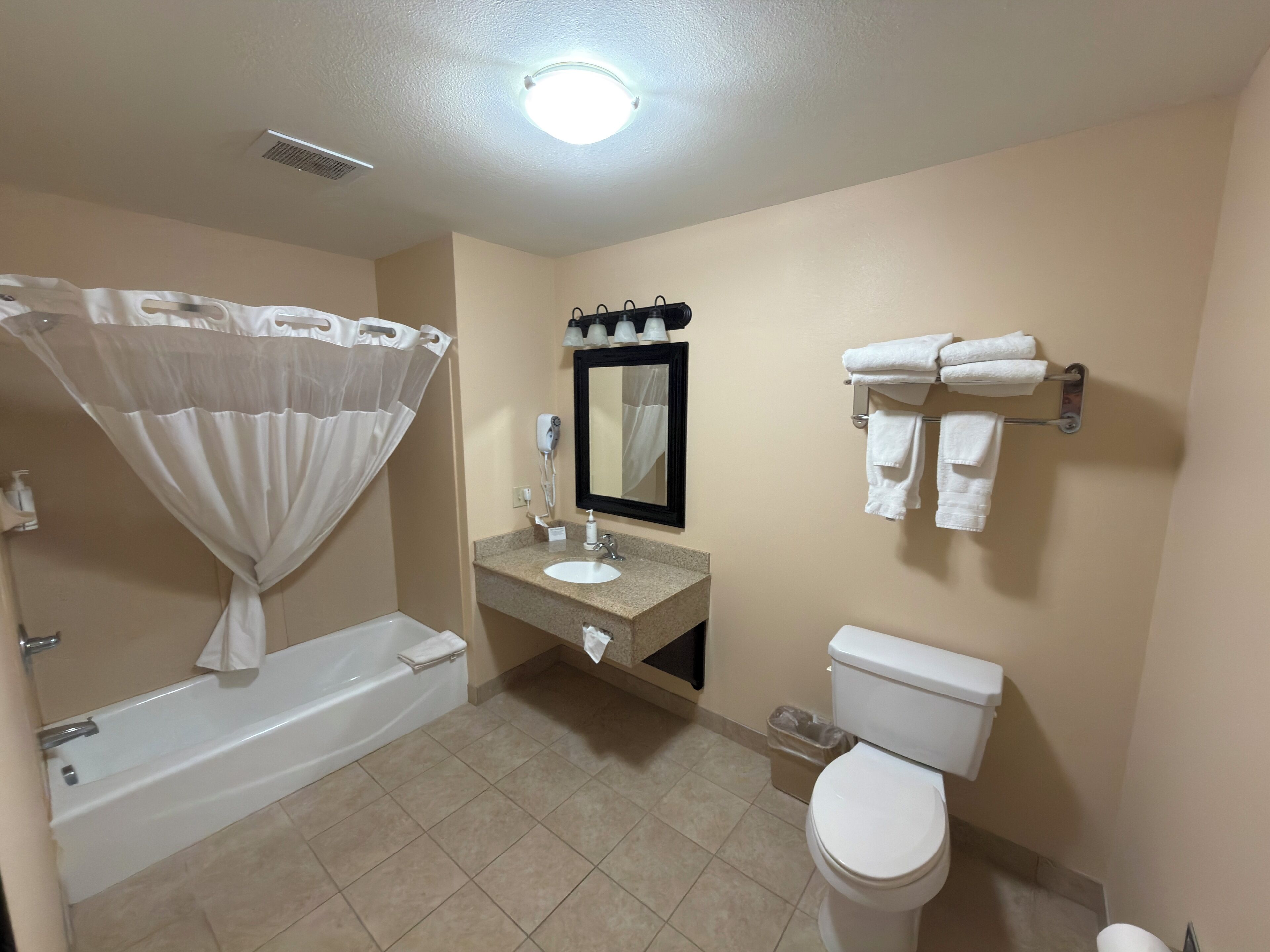 Suite, 2 Queen Beds, Kitchenette | Bathroom | Combined shower/tub, deep soaking tub, free toiletries, hair dryer