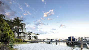 On the beach, white sand, sun loungers, beach umbrellas