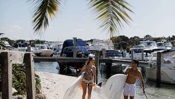 On the beach, white sand, sun loungers, beach umbrellas