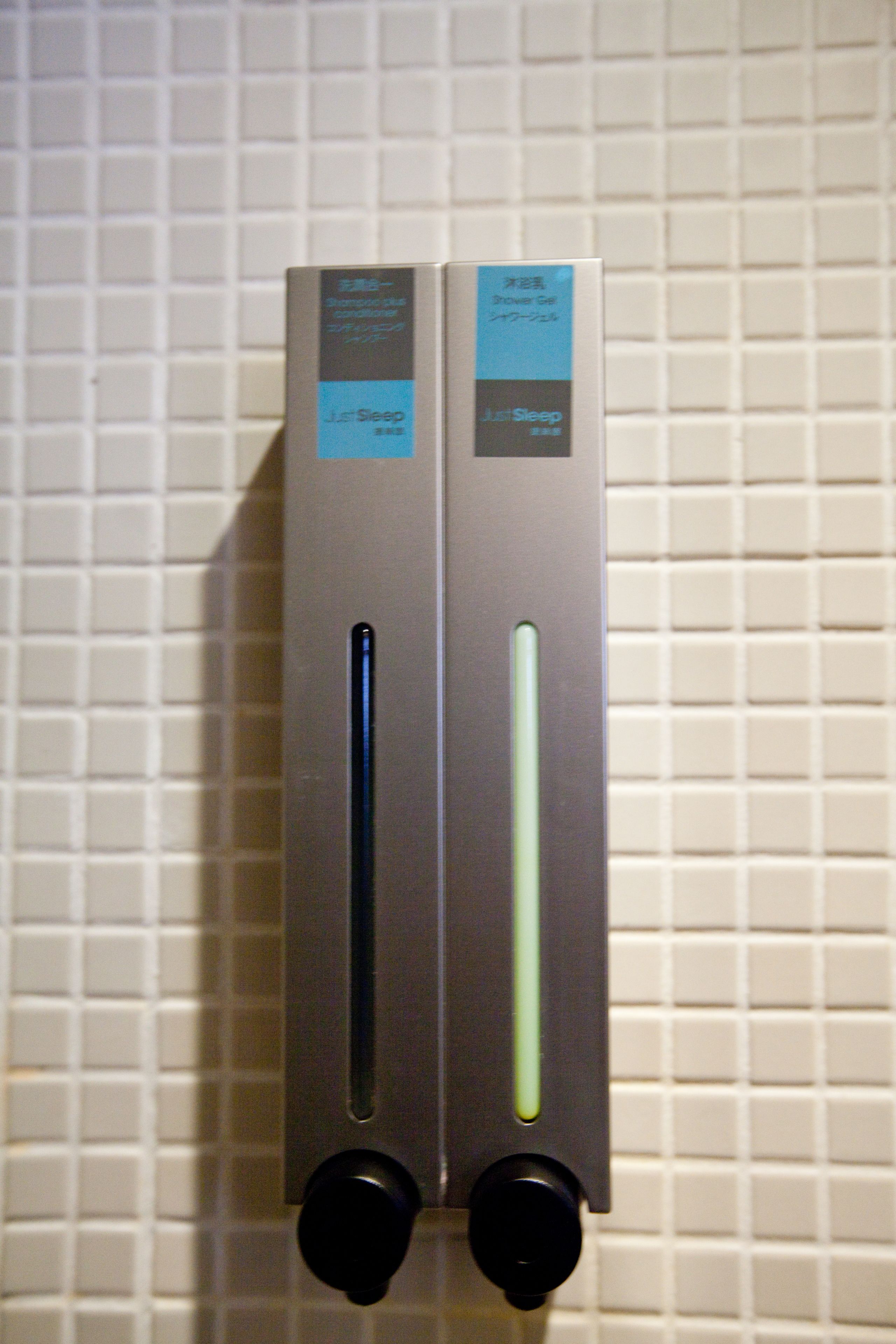 shower, hair dryer, slippers, towels