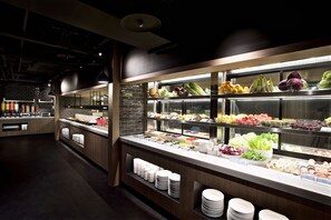 A buffet area with various food items and condiments. - Just Sleep Taipei Ximending (Taipei)