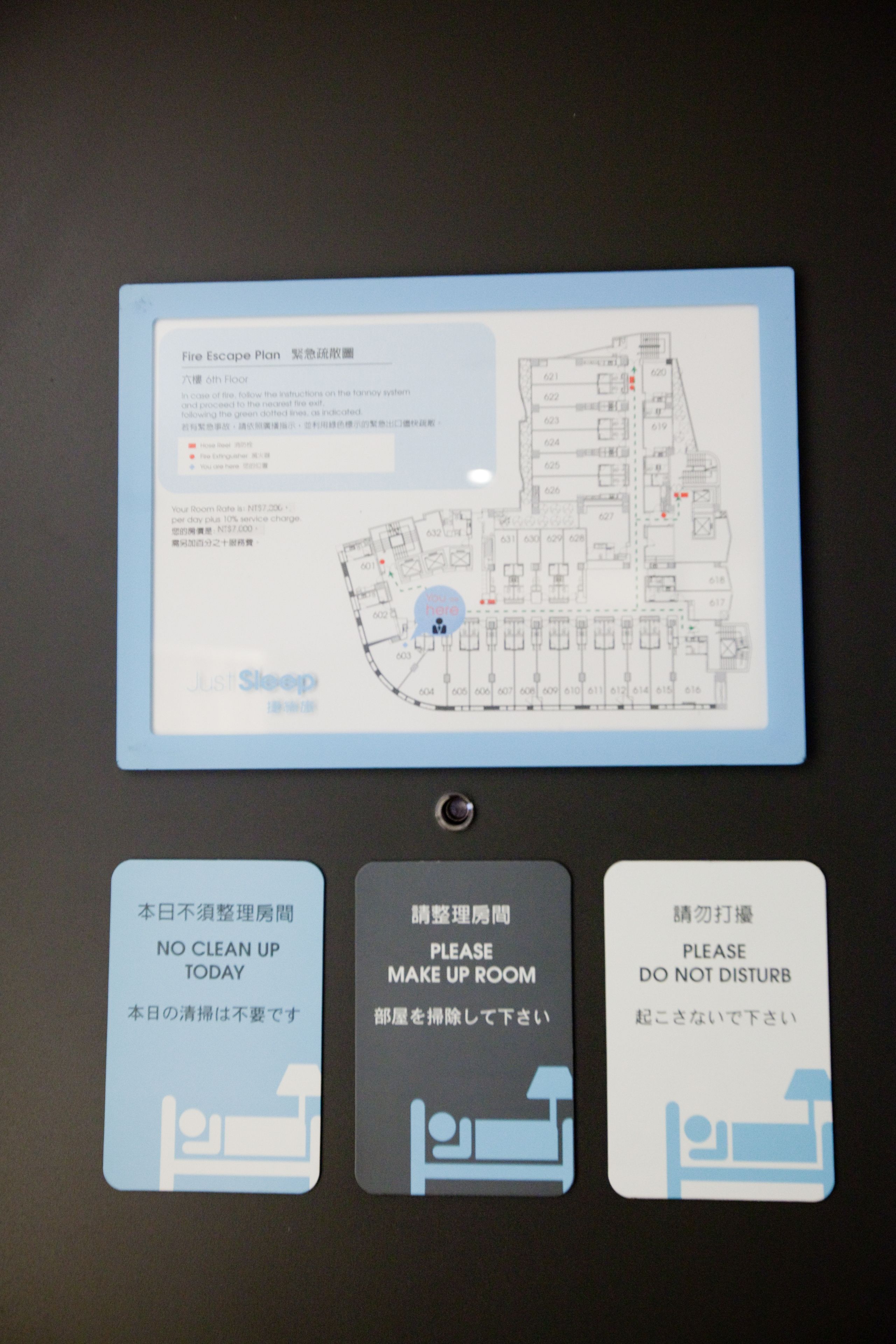 A fire escape plan with a floor plan and three informational cards below.