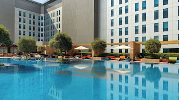 Outdoor pool, open 6:00 AM to 8:00 PM, pool umbrellas, pool loungers