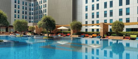 Outdoor pool, open 6:00 AM to 8:00 PM, pool umbrellas, pool loungers