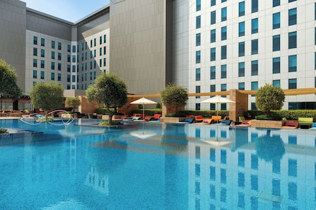 Outdoor pool, open 6:00 AM to 8:00 PM, pool umbrellas, sun loungers