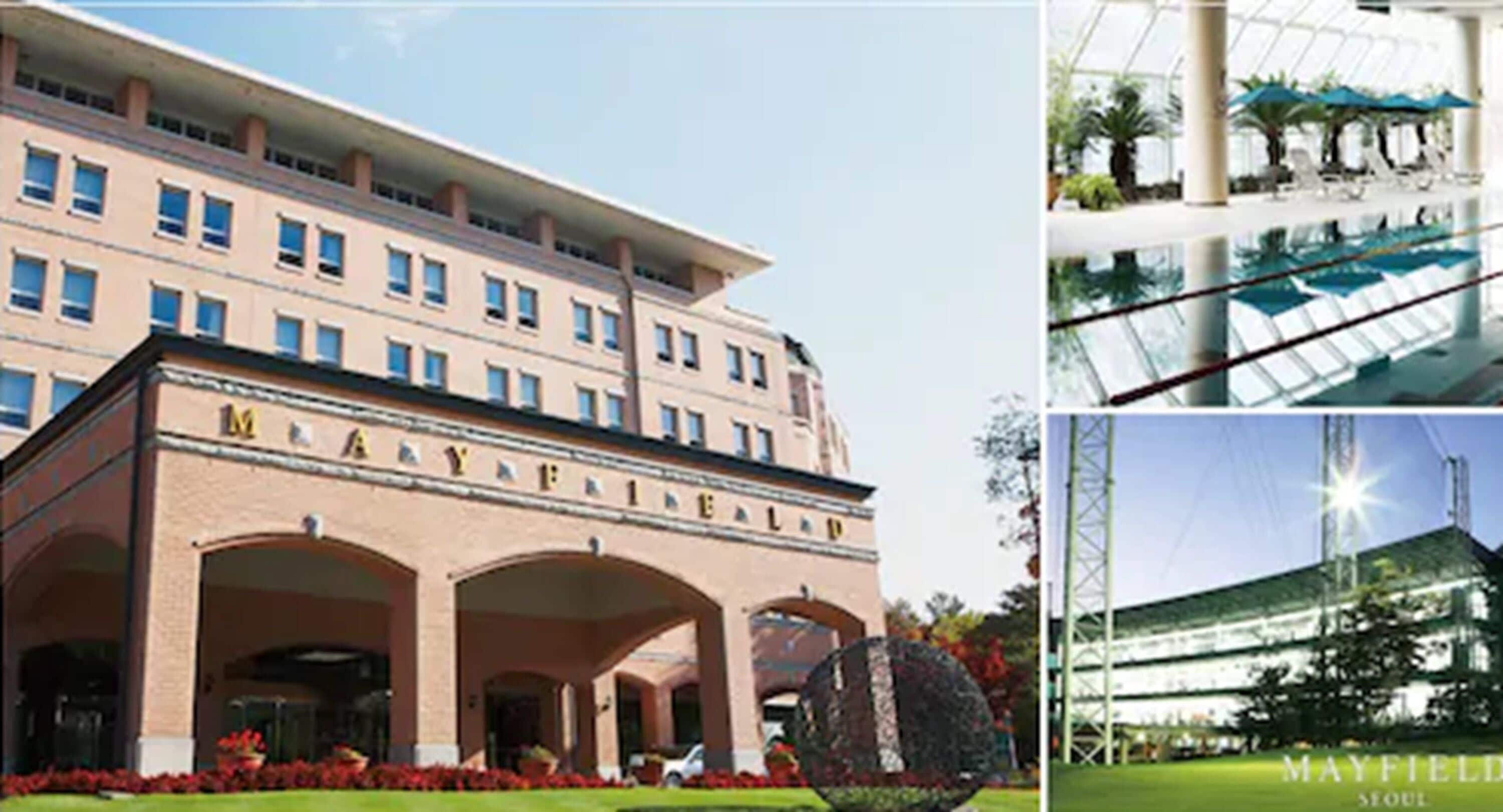 A multi-story hotel with a prominent entrance, a swimming pool area, and a modern building with a glass facade.