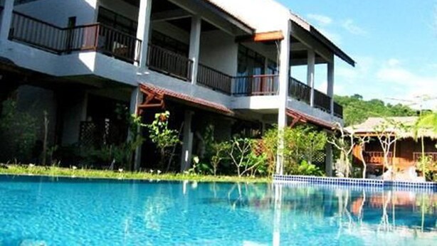 A two-story building with a swimming pool in front. - Villa Molek (Langkawi)