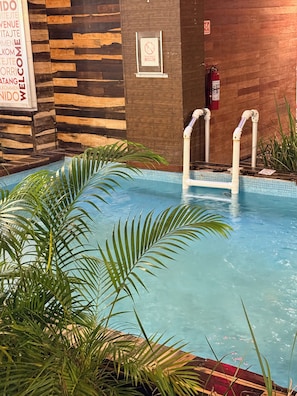 Indoor pool, outdoor pool, pool umbrellas, sun loungers