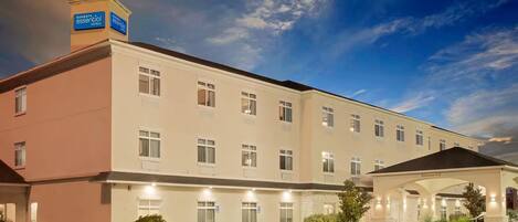 A Sonesta Essential hotel with a two-story structure, a covered entrance, and a parking lot.