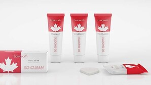 A basicearth hair care kit, including shampoo, conditioner, and body lotion, along with a box and a sachet. - Canadas Best Value Inn Mile 0 (Lillooet)