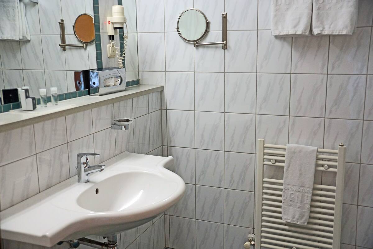 hair dryer, towels, soap, shampoo