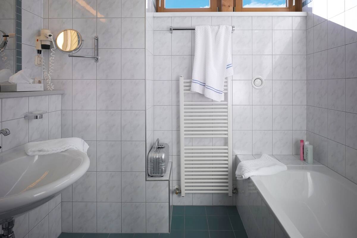 bathroom | hair dryer, towels, soap, shampoo