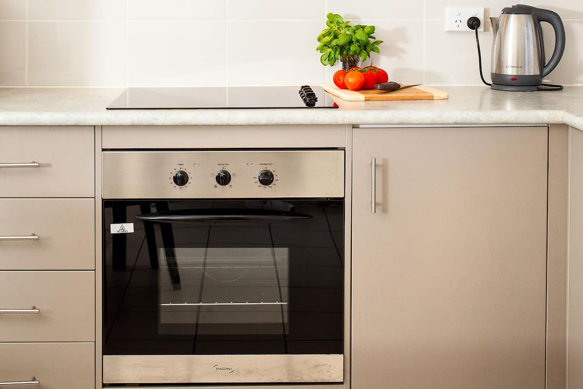 Premium One Bedroom Apartment (Guests 8 Years Old and Over Only) | Private kitchen | Full-size fridge, microwave, oven, stovetop