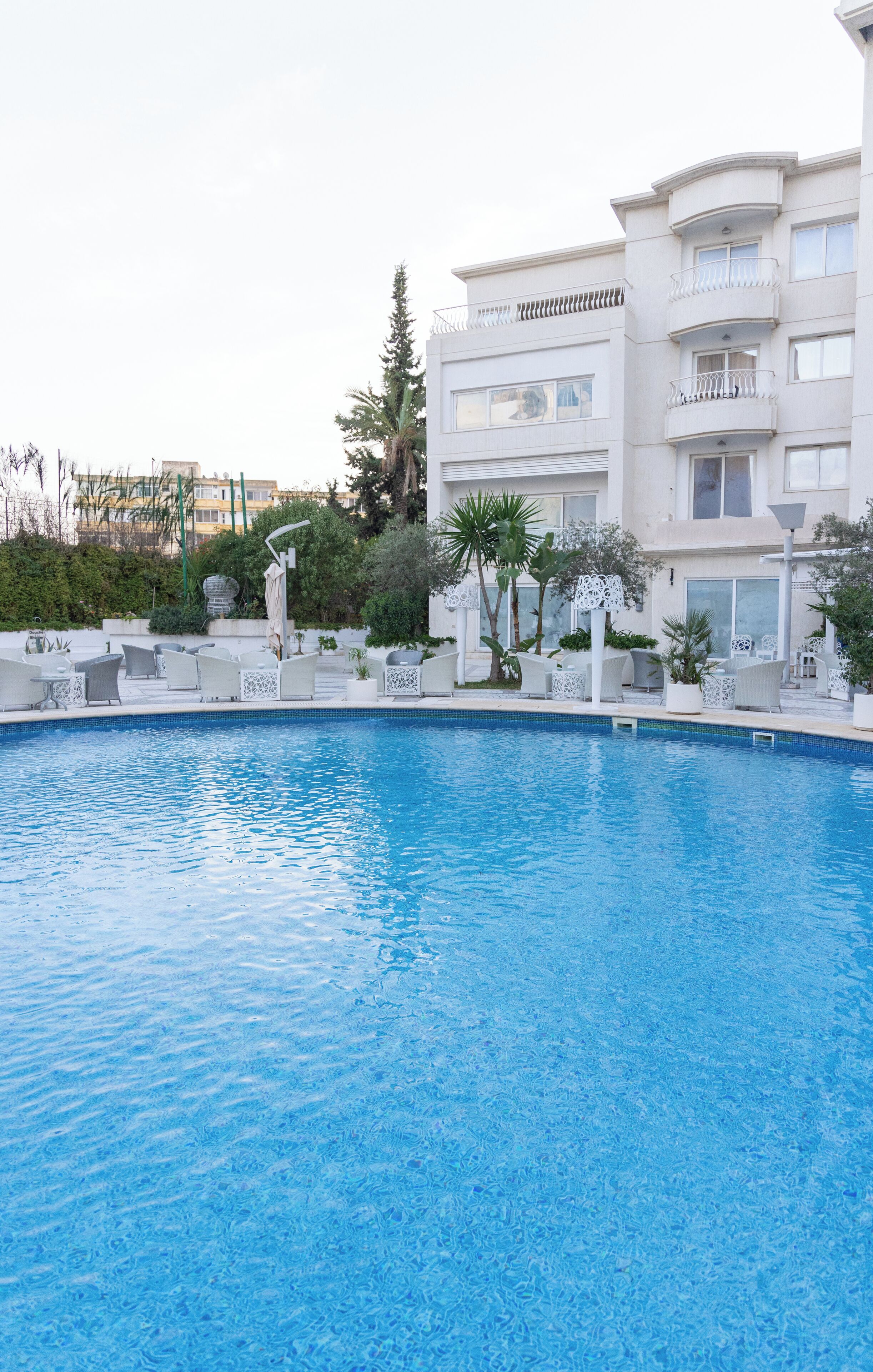 outdoor pool, pool umbrellas, pool loungers