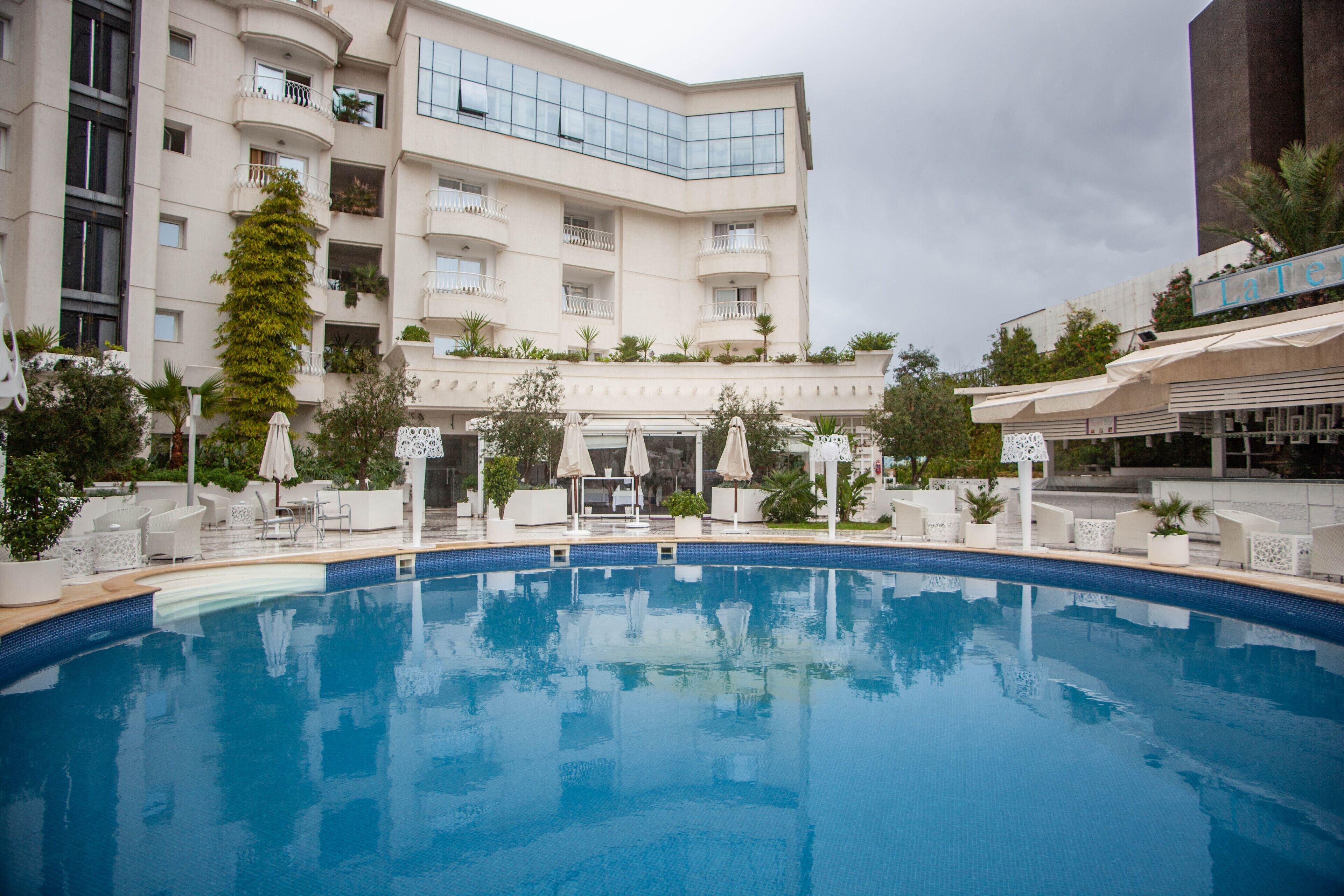 outdoor pool, pool umbrellas, pool loungers