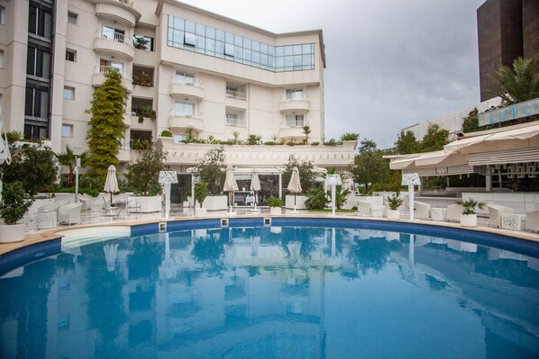 Outdoor pool, pool umbrellas, pool loungers