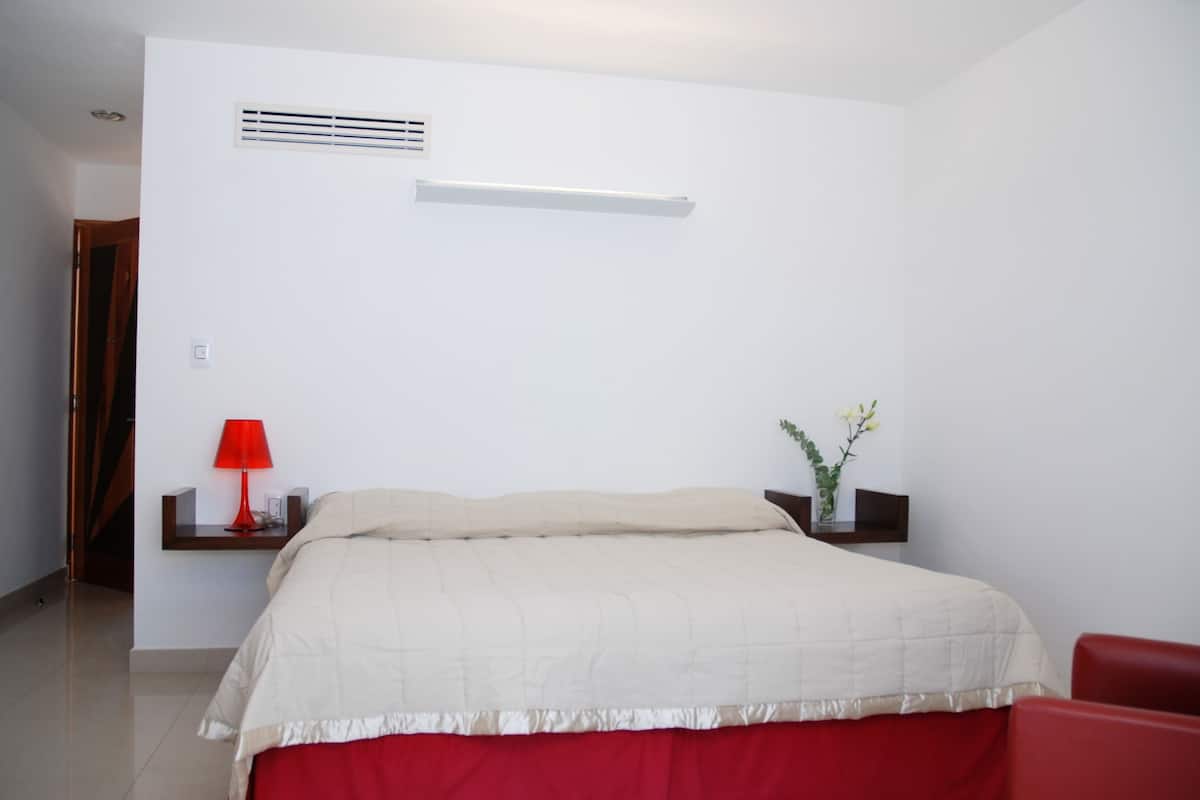 Deluxe Room, 1 King Bed | Premium bedding, minibar, in-room safe, individually decorated