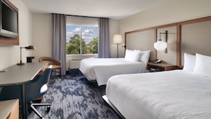 A hotel room with two beds, a desk, a chair, a TV, and a window with curtains. - Fairfield Inn & Suites by Marriott Albany (Albany)