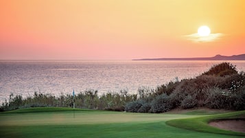 Enjoy a round of golf on our well-manicured course with a serene lake view.