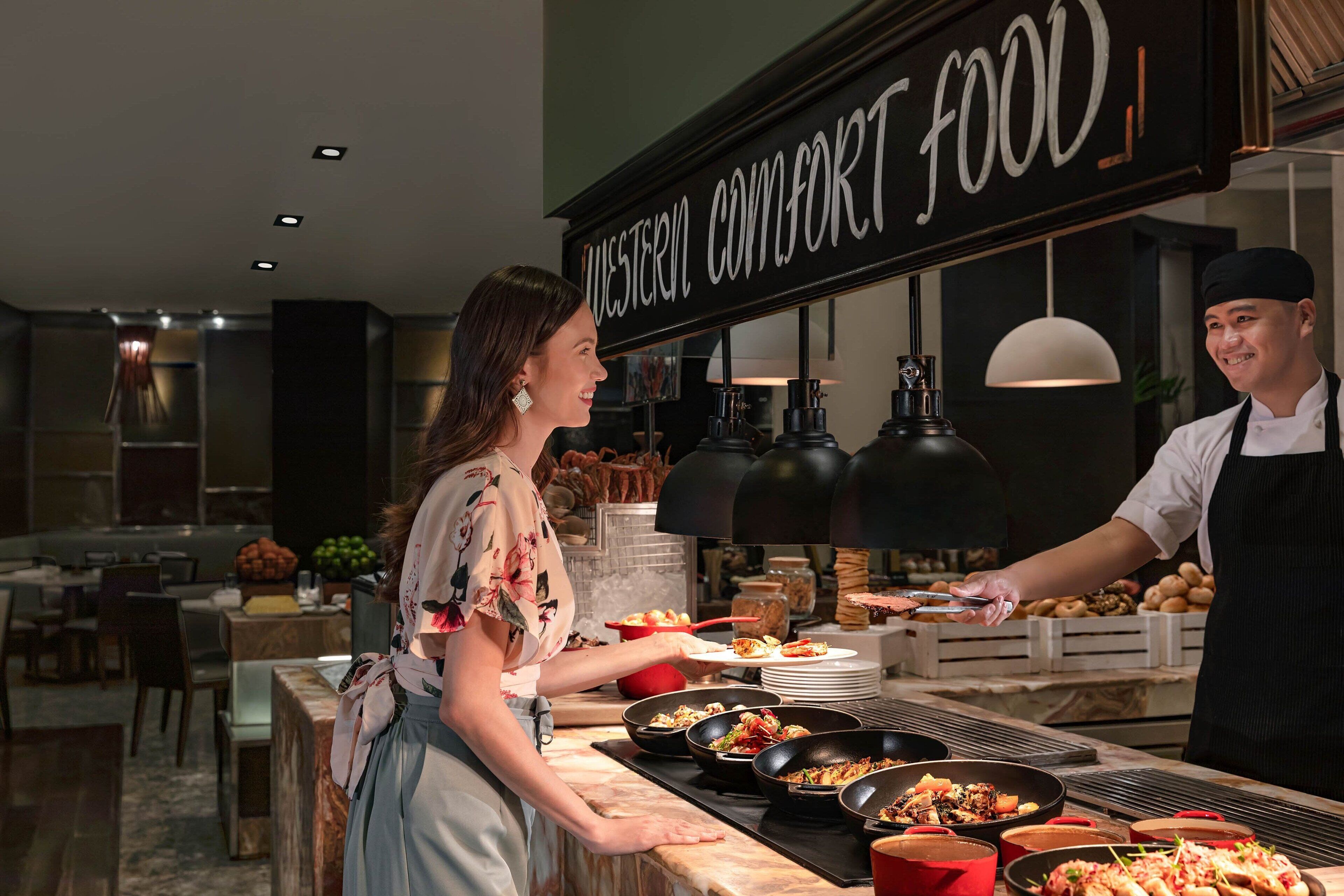 A restaurant counter with a sign reading "Western Comfort Food".
