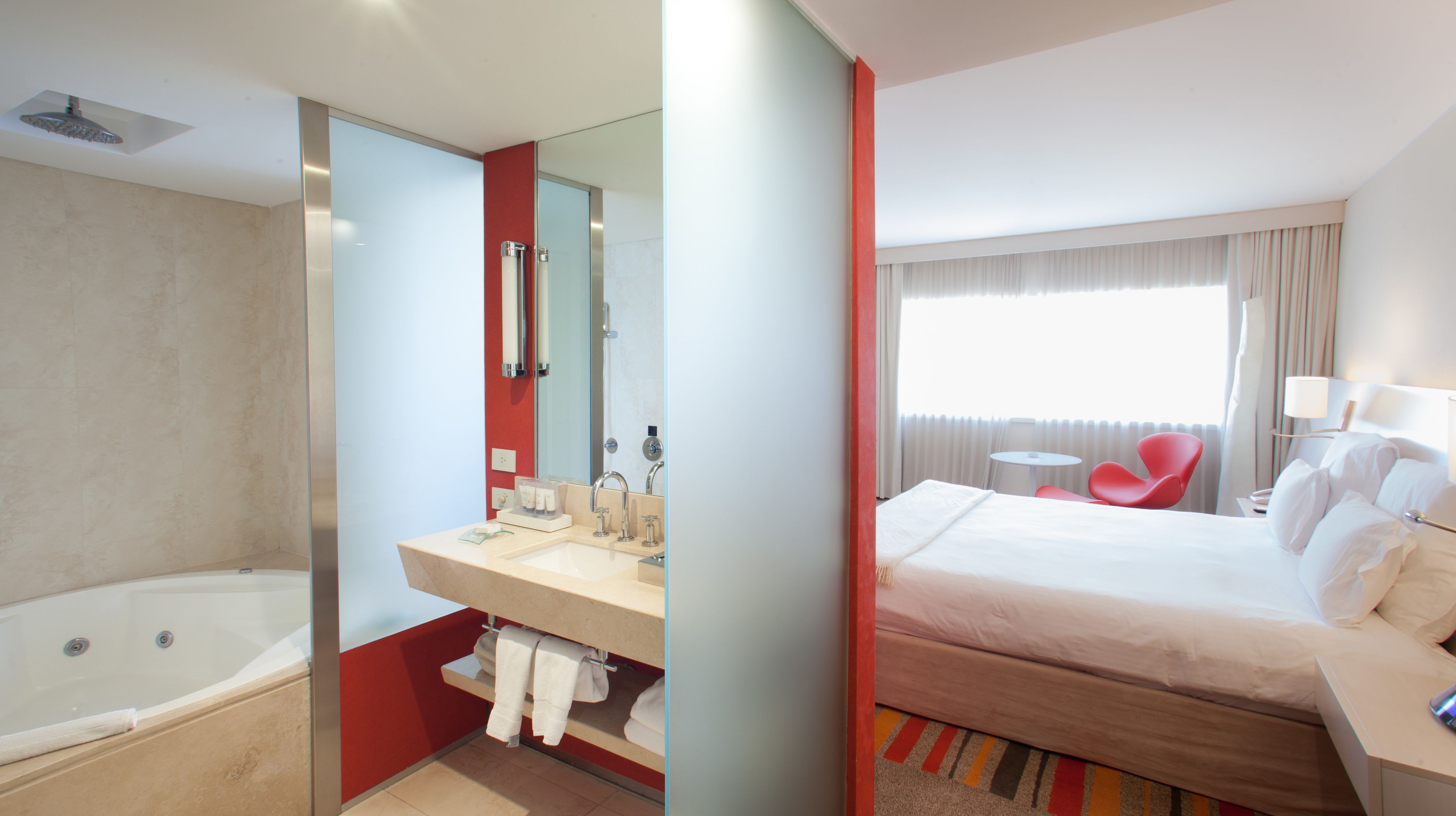 superior double room | bathroom | bathtub, rainfall showerhead, free toiletries, hair dryer