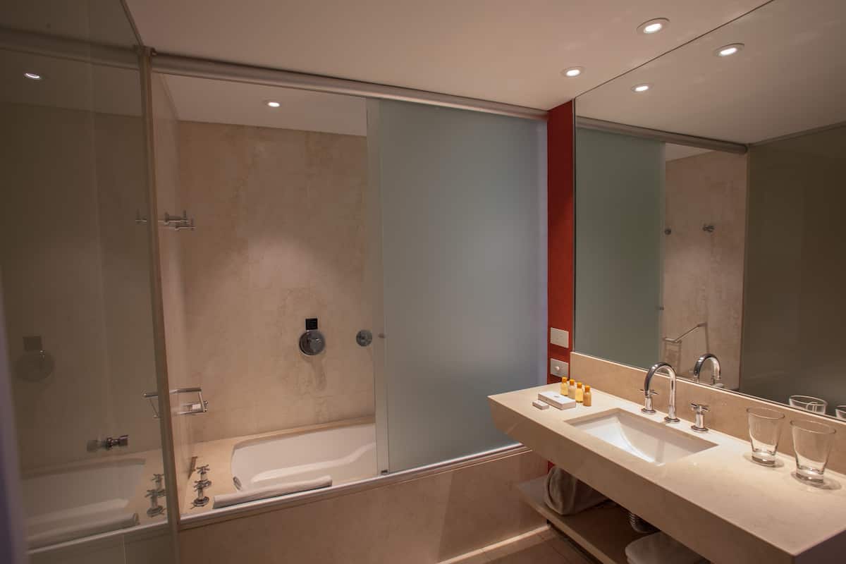 bathtub, rainfall showerhead, free toiletries, hair dryer