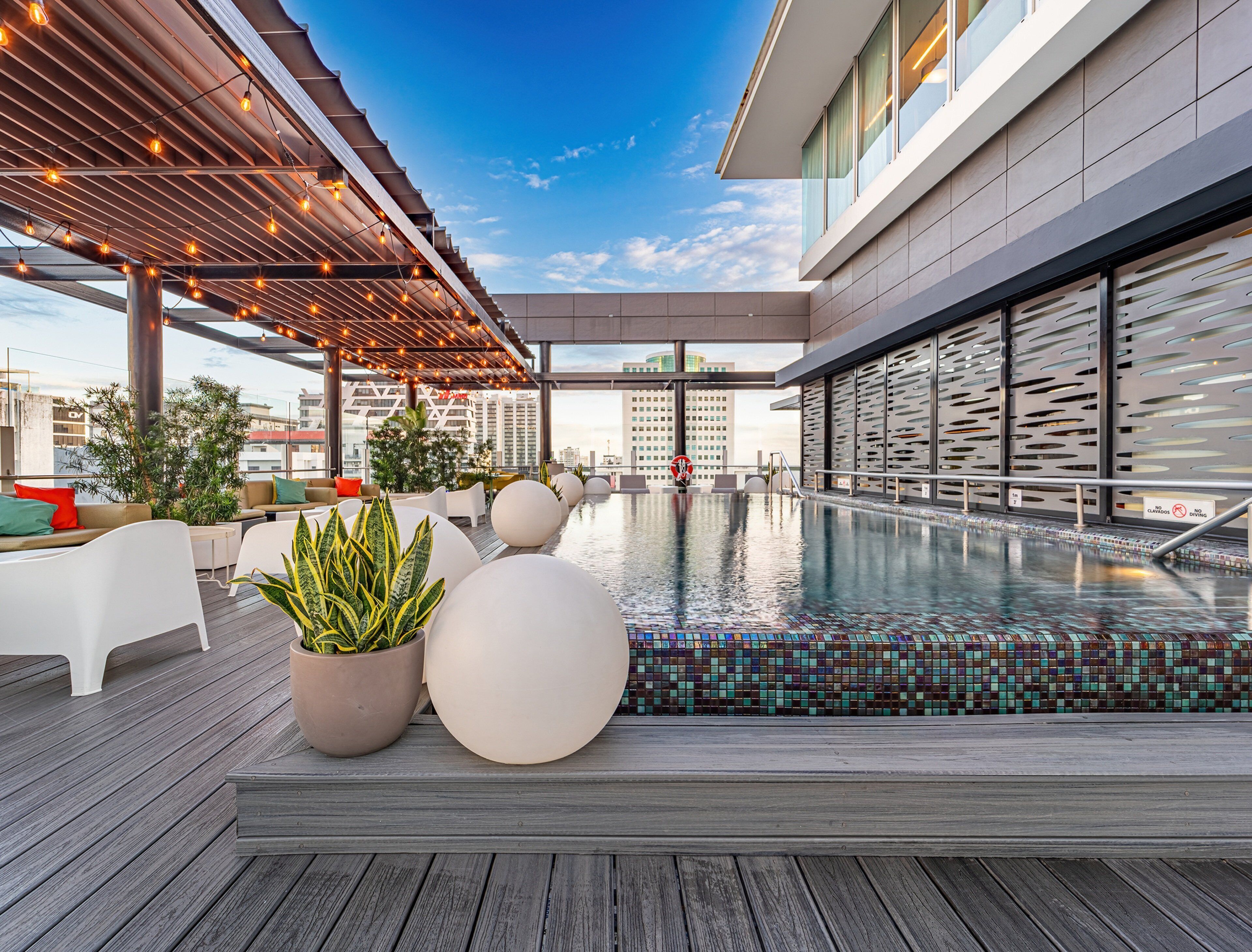 outdoor pool, open 8:00 am to 9 pm, pool umbrellas, pool loungers