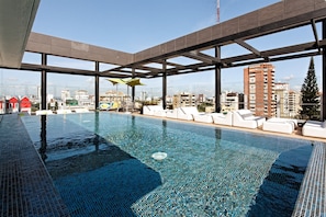 Outdoor pool, open 8:00 AM to 9 PM, pool umbrellas, pool loungers