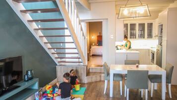 Two Bedroom Family Luxury Apartment | Living area | 57-cm TV with satellite channels, iPod dock