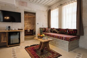Suite | Living area | 25-inch LCD TV with cable channels, TV - Cappadocia Cave Suites (Nevsehir)