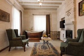 Suite | Living area | 25-inch LCD TV with cable channels, TV - Cappadocia Cave Suites (Nevsehir)