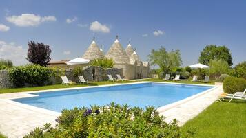 Outdoor pool, open 7:30 AM to 8:00 PM, pool loungers