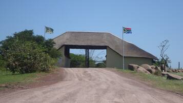 Guests may enjoy a secluded stay at this rustic lodge, surrounded by natural scenery and trees.